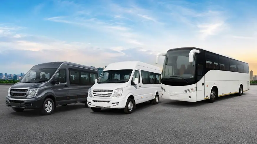 Force Urbania van, Tempo Traveller and bus parked together