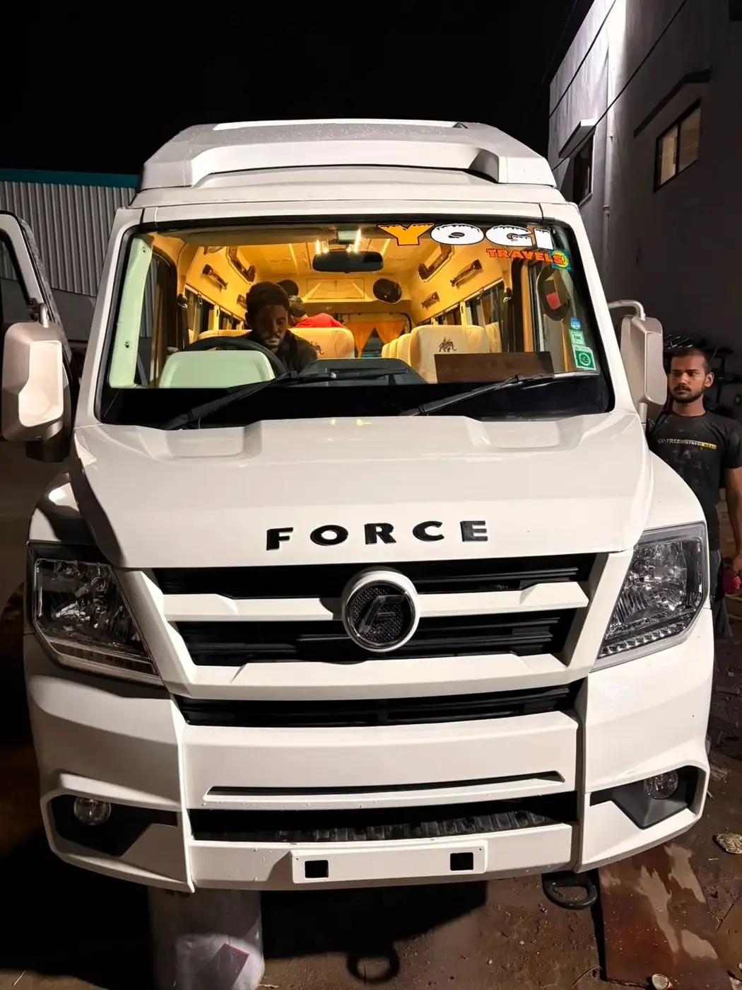 White Tempo Traveller 17 seater, front view