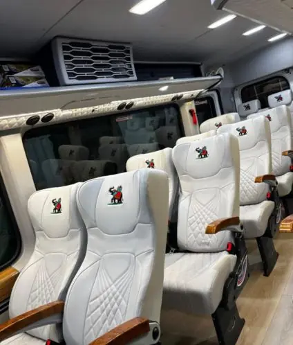 Premium white leather seats with an embossed elephant emblem